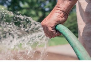 hand holding a hosepipe
