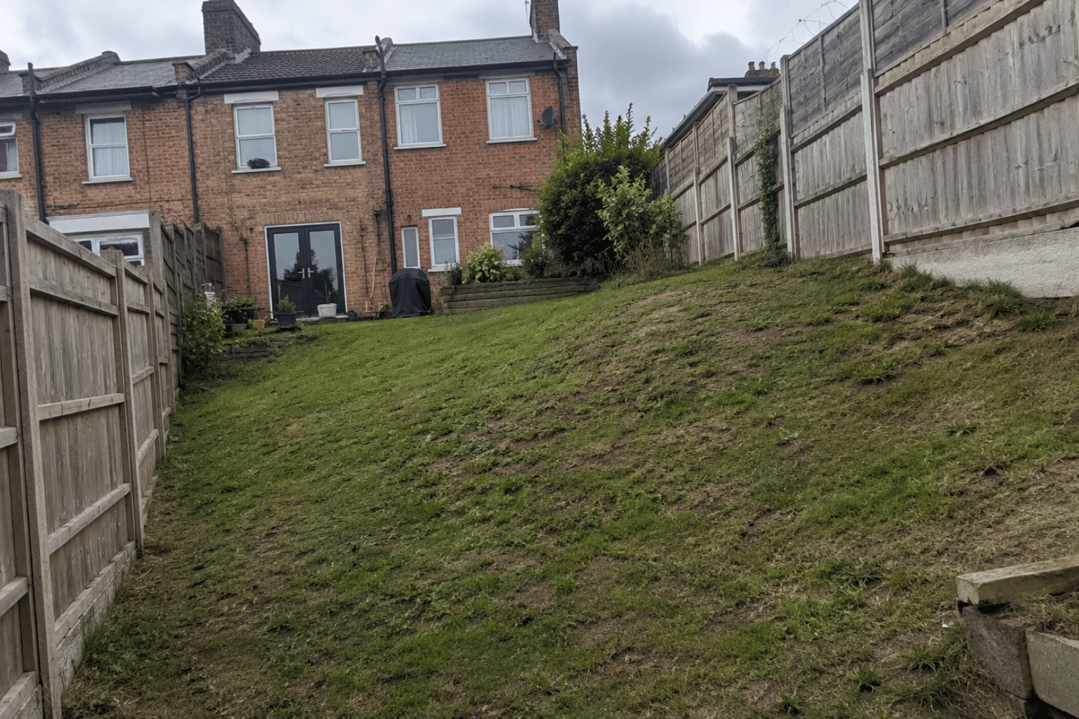 Sloped back garden in South East London needing levelling