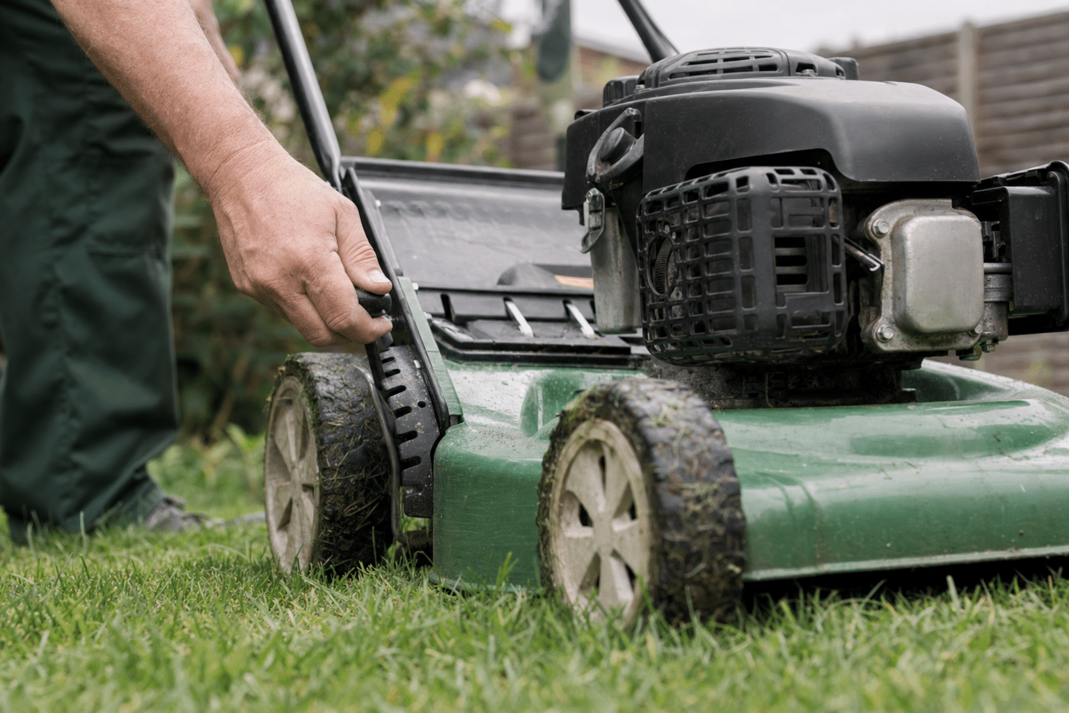 mower blades raised for the last cut on a wet lawn in Catford SE6